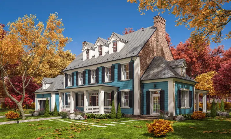 Blue painted colonial house exterior with white shutters and columns