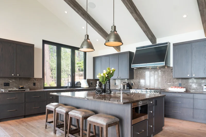 Modern kitchen with elegant charcoal gray painted cabinets