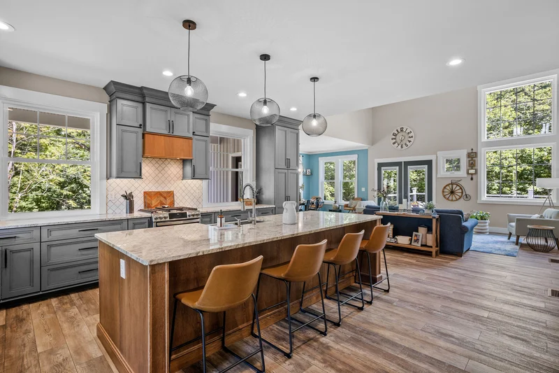 Elegant kitchen interior featuring professional cabinet painting in gray.
