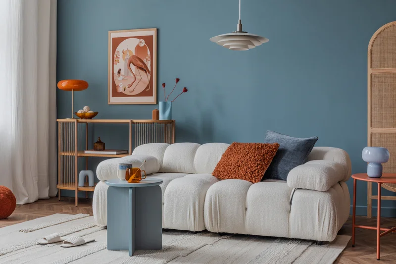 Teal living room accent wall painted professionally with retro decor.